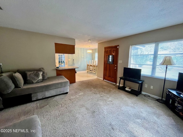 carpeted living room featuring a textured ceiling