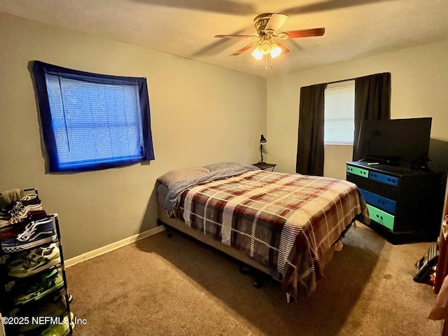 bedroom featuring ceiling fan and carpet floors