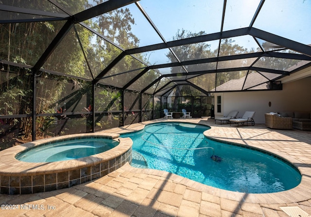 view of swimming pool featuring an outdoor living space, a patio area, glass enclosure, and an in ground hot tub