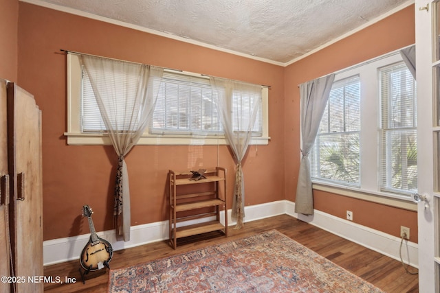 sitting room featuring hardwood / wood-style floors and ornamental molding