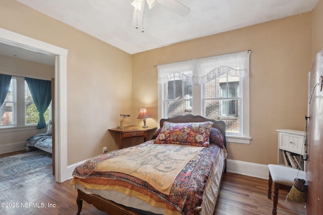 bedroom with hardwood / wood-style floors and ceiling fan