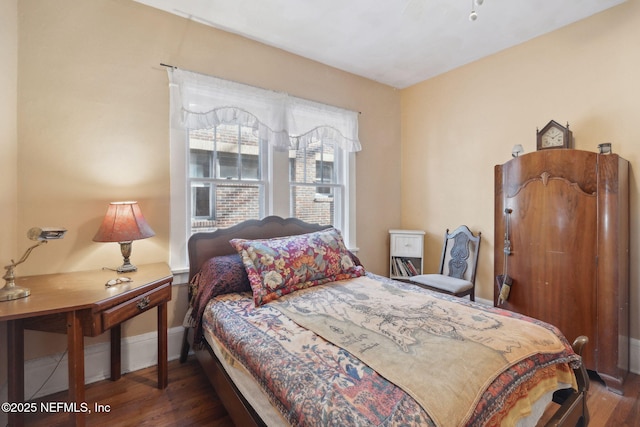 bedroom featuring dark hardwood / wood-style flooring