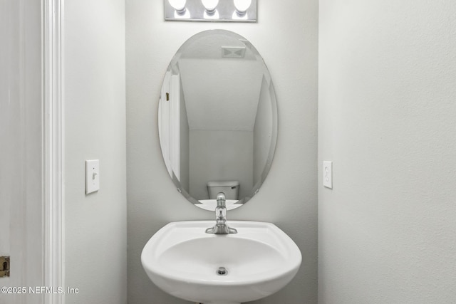 bathroom with sink and toilet