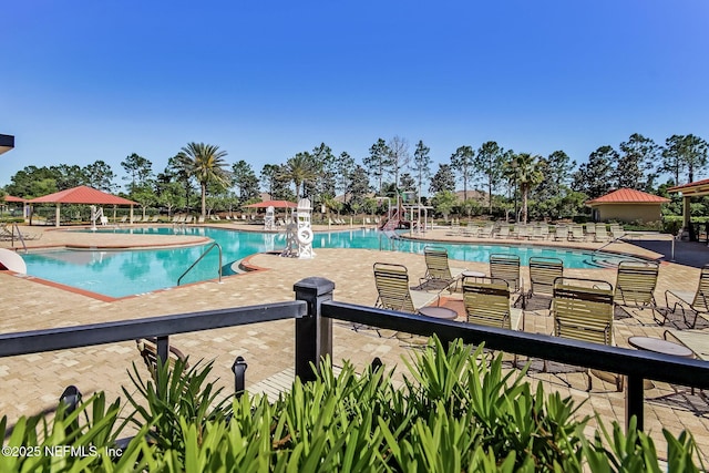 view of swimming pool featuring a gazebo and a patio