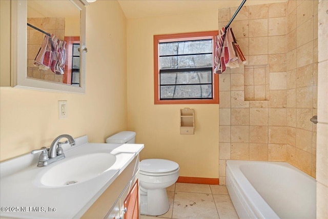 full bathroom featuring tile patterned flooring, vanity, toilet, and tiled shower / bath