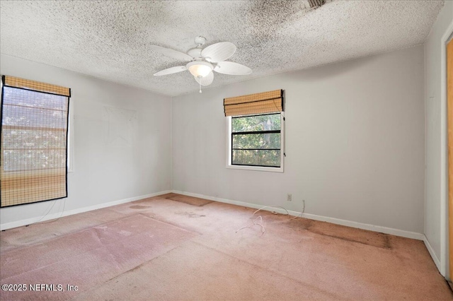 unfurnished room with light carpet, a textured ceiling, and ceiling fan