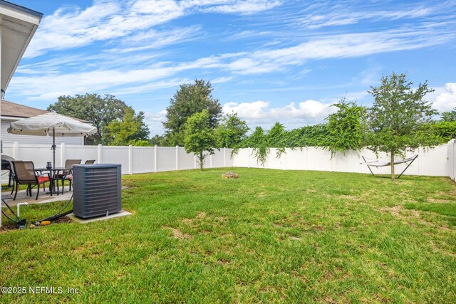 view of yard with central AC