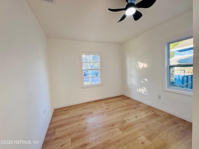 spare room featuring ceiling fan and light wood-type flooring