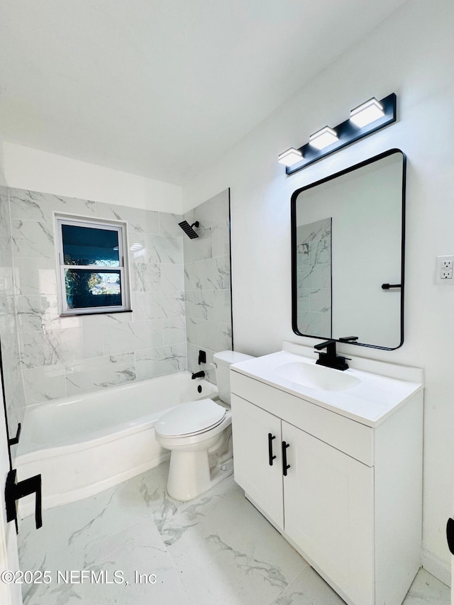 full bathroom featuring vanity, tiled shower / bath combo, and toilet