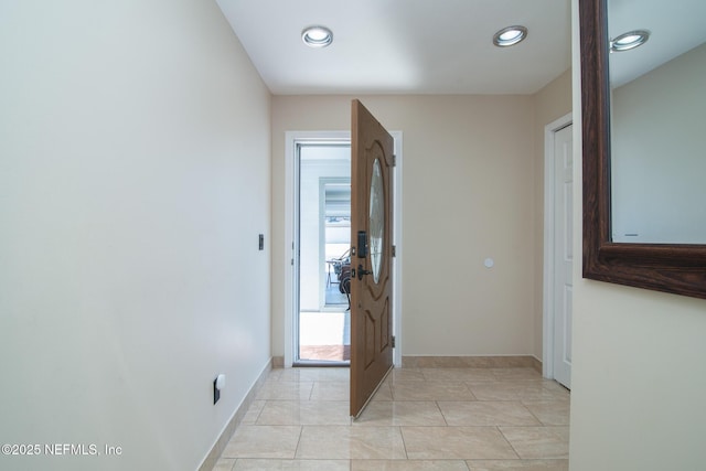 hallway with light tile patterned floors