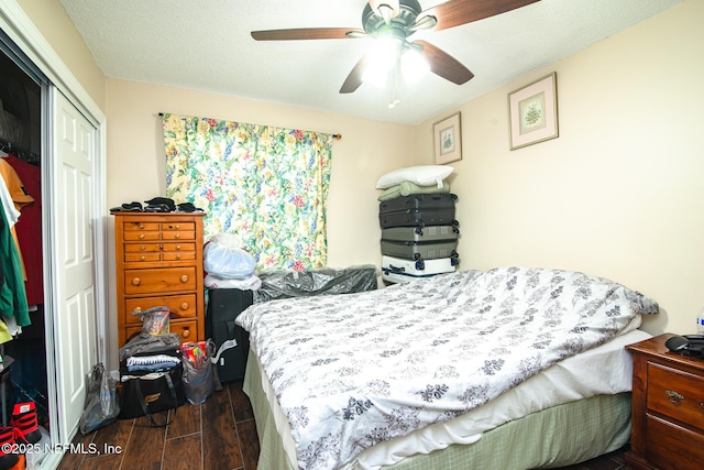 bedroom featuring ceiling fan and a closet