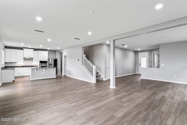 unfurnished living room with light wood-type flooring