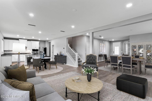 living room with light hardwood / wood-style floors