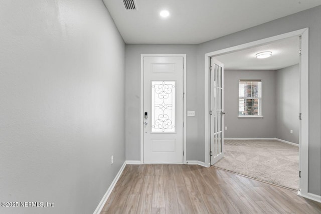 entrance foyer with light hardwood / wood-style flooring