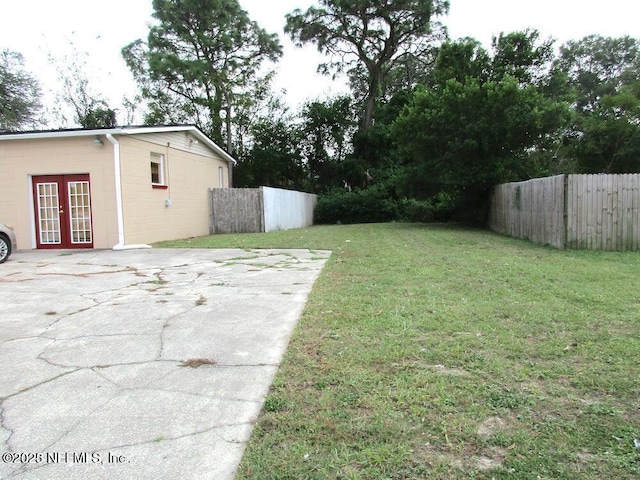 view of yard featuring french doors