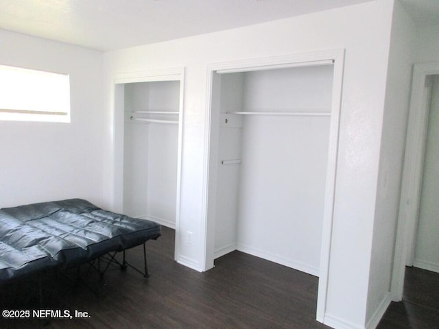 bedroom featuring dark wood-type flooring