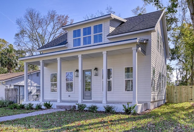 view of front of property featuring a porch and a front lawn