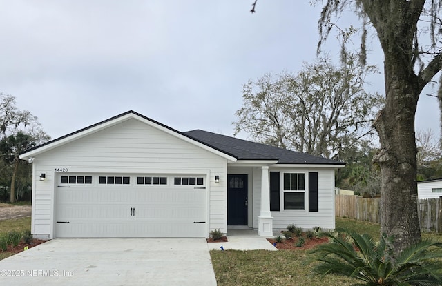 ranch-style home featuring a garage