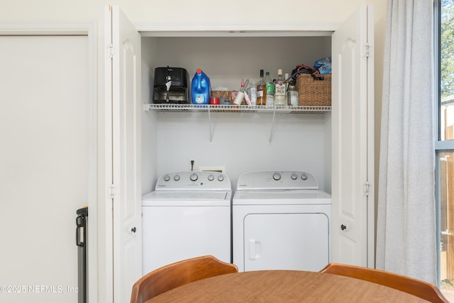 laundry area with washing machine and clothes dryer