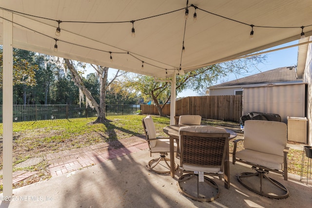 view of patio featuring a grill