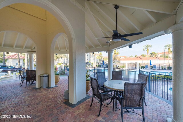 view of patio / terrace featuring ceiling fan and a community pool