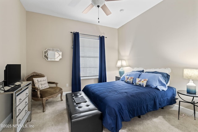 bedroom with ceiling fan and light colored carpet