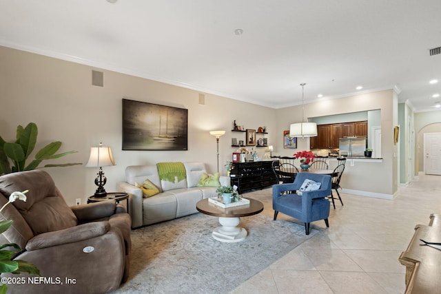 tiled living room featuring ornamental molding