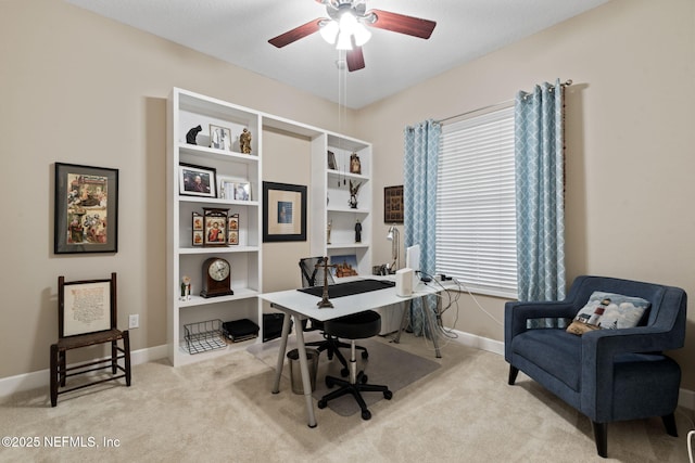 office featuring ceiling fan and light carpet