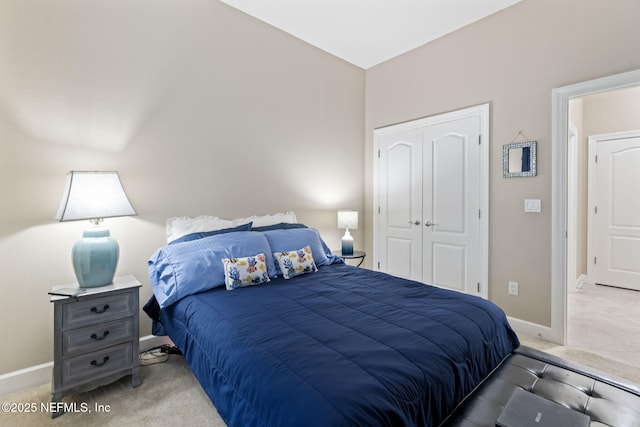 carpeted bedroom with a closet