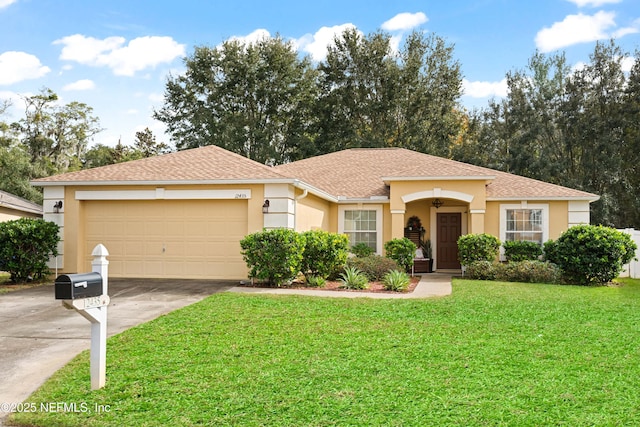 view of front of home with a garage and a front yard