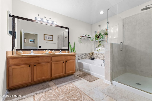 bathroom with vanity, plus walk in shower, and tile patterned flooring