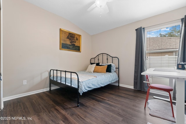 bedroom featuring ceiling fan, lofted ceiling, and dark hardwood / wood-style flooring