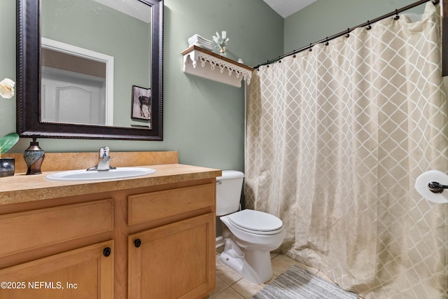 bathroom with vanity, tile patterned floors, and toilet