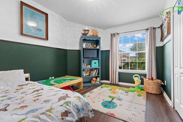 bedroom featuring dark wood-type flooring