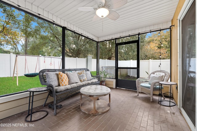 sunroom / solarium with ceiling fan