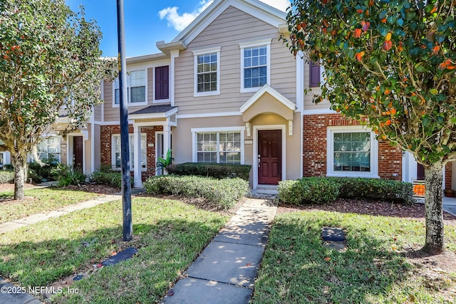 view of property featuring a front yard