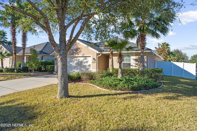 single story home with a front yard and a garage