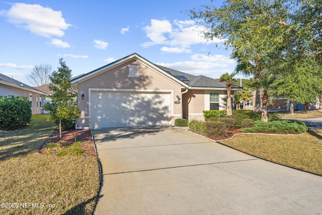 ranch-style house with a front yard, a garage, and solar panels