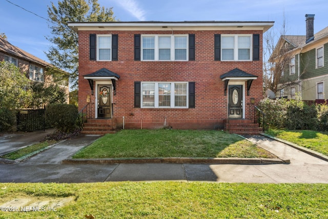 view of front of home with a front yard