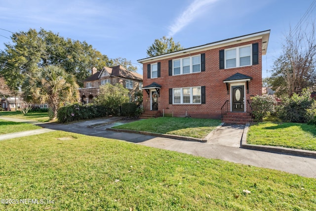 view of front of home with a front lawn