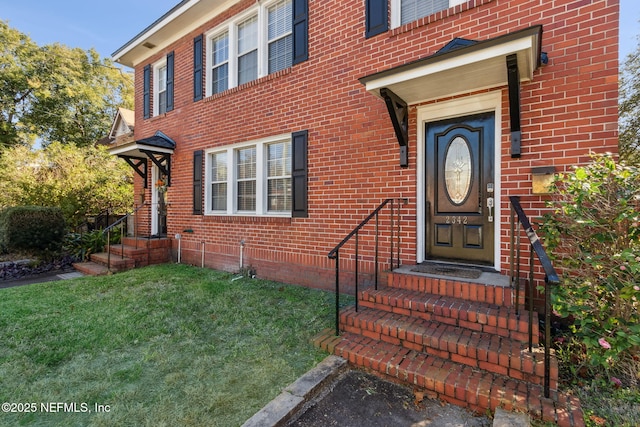 property entrance with a yard