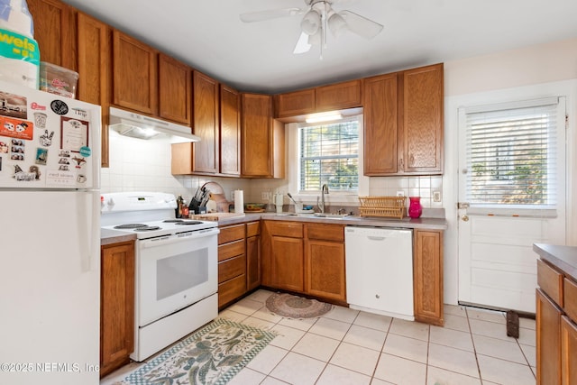 kitchen with ceiling fan, sink, white appliances, decorative backsplash, and light tile patterned flooring