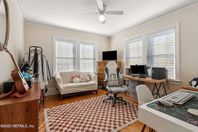 office area with crown molding, plenty of natural light, ceiling fan, and hardwood / wood-style flooring