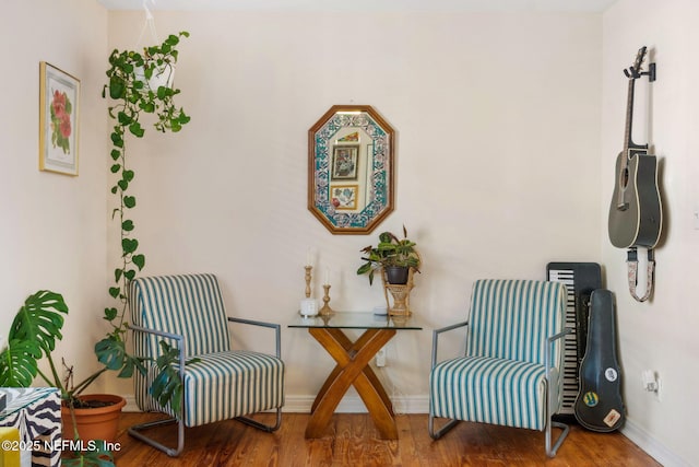 sitting room with hardwood / wood-style flooring