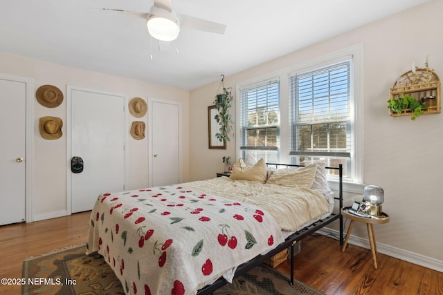 bedroom featuring ceiling fan and dark hardwood / wood-style floors