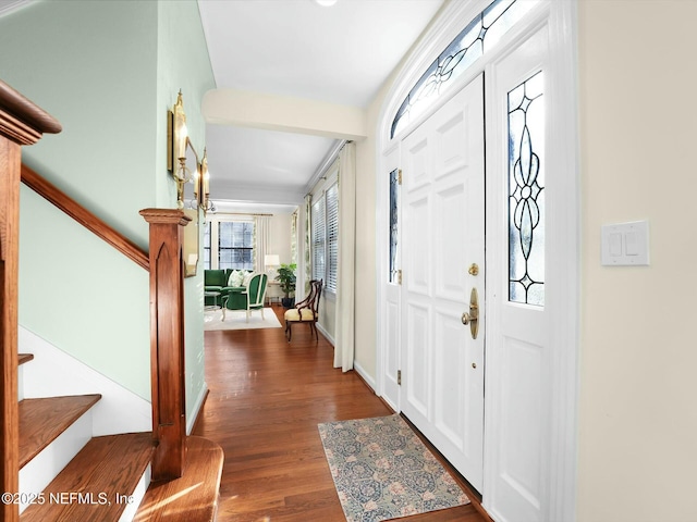 foyer with dark hardwood / wood-style floors