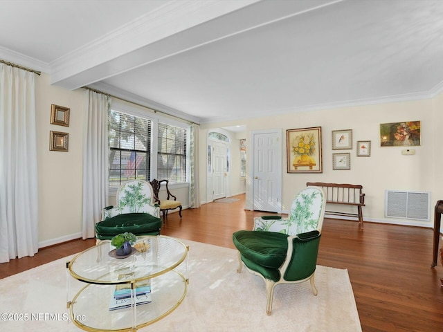 sitting room with ornamental molding and hardwood / wood-style flooring