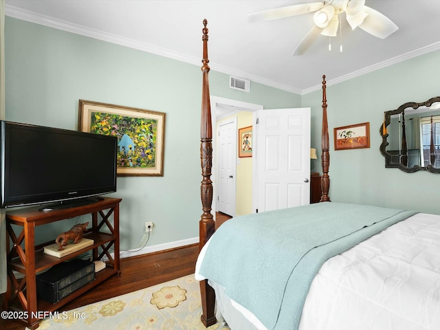 bedroom featuring dark hardwood / wood-style flooring, ornamental molding, and ceiling fan