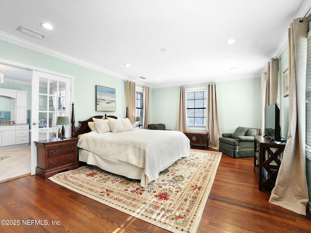 bedroom featuring ornamental molding and dark wood-type flooring