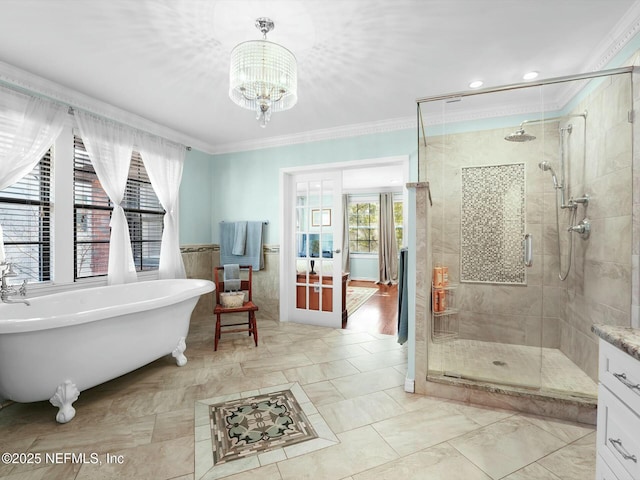 bathroom with a notable chandelier, a healthy amount of sunlight, crown molding, and plus walk in shower